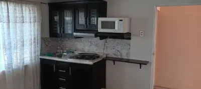 Una cocina o zona de cocina en Departamento J y L