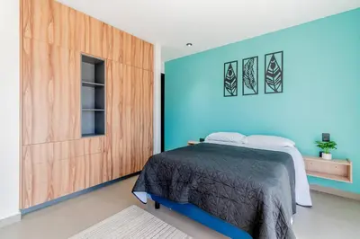 Cama o camas de una habitación en Depa Industrial Moderno y lujoso