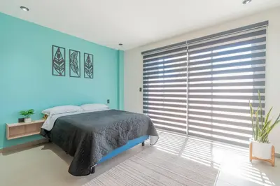 Cama o camas de una habitación en Depa Industrial Moderno y lujoso