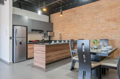 Una cocina o zona de cocina en Depa Industrial Lujoso