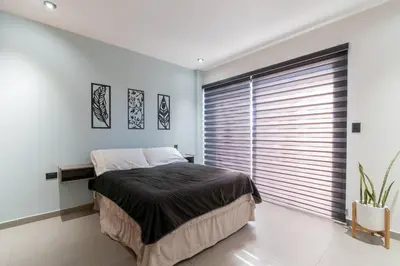 Cama o camas de una habitación en Depa Industrial Lujoso