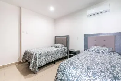 Cama o camas de una habitación en Paraíso Costero Elegante Condo con Vista al Mar