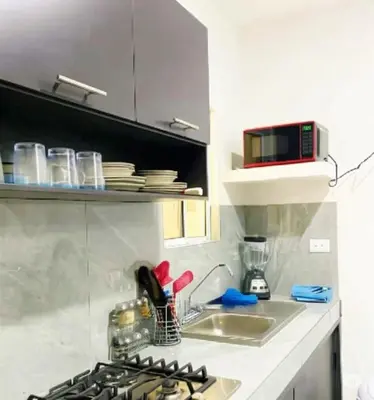 Una cocina o zona de cocina en Departamento El Tesoro - Olas Azules - 3 Min Malecón y Playas