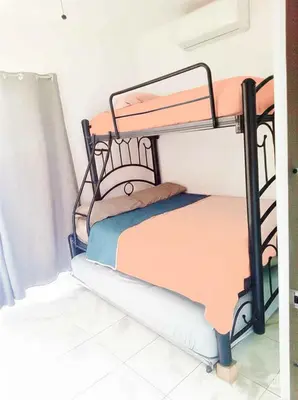 Cama o camas de una habitación en Departamento El Tesoro - Olas Azules - 3 Min Malecón y Playas