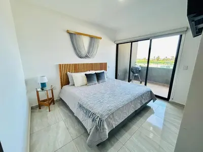Cama o camas de una habitación en moderno con alberca cerca de la playa by G P S rentas