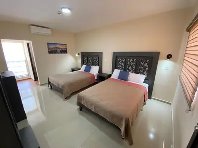 Cama o camas de una habitación en Hotel Vistas Juventud