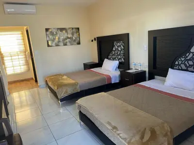 Cama o camas de una habitación en Hotel Vistas Juventud