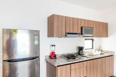 Una cocina o zona de cocina en Hermoso Depa Ejecutivo en el Corazon de Mazatlán