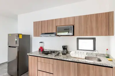 Una cocina o zona de cocina en Hermoso Depa Ejecutivo en el Corazon de Mazatlán