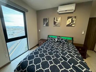 Cama o camas de una habitación en Departamento Nuevo Frente al TSM