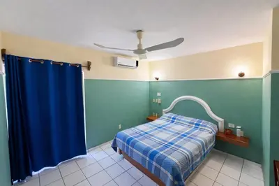 Cama o camas de una habitación en Blue Pacific Suites
