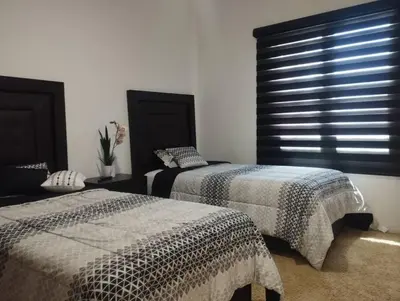 Cama o camas de una habitación en Hermosa casa a 5 minutos del consulado Americano, cuenta con 3 recamaras, sistema de refrigeración y calefacción