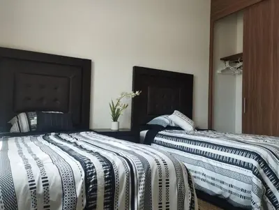 Cama o camas de una habitación en Hermosa casa a 5 minutos del consulado Americano, cuenta con 3 recamaras, sistema de refrigeración y calefacción