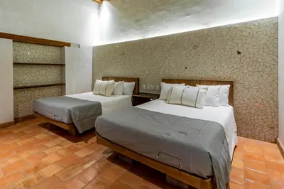 Cama o camas de una habitación en La Gloria Mesón