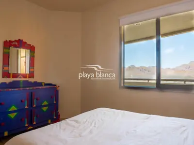 Cama o camas de una habitación en Playa Blanca Premier Unit 1410