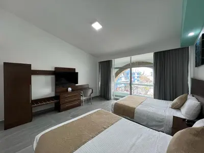 Cama o camas de una habitación en Solamar Inn Mazatlan