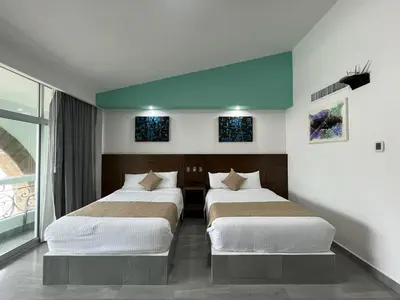 Cama o camas de una habitación en Solamar Inn Mazatlan
