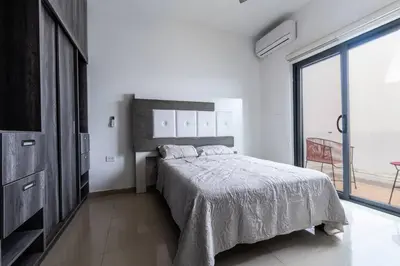 Cama o camas de una habitación en Elegante depa super céntrico en zona dorada