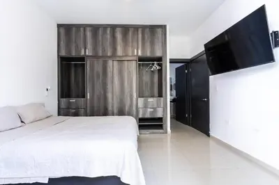 Cama o camas de una habitación en Elegante depa super céntrico en zona dorada