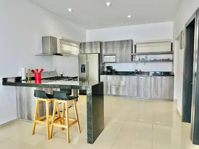 Una cocina o zona de cocina en Elegante depa super céntrico en zona dorada 1