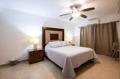 Cama o camas de una habitación en Elegante depa frente al malecón y cerca del centro