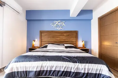Cama o camas de una habitación en Departamento frente al mar cerca de Mazagua