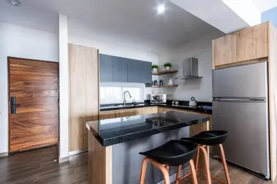 Una cocina o zona de cocina en Departamento frente al mar cerca de Mazagua