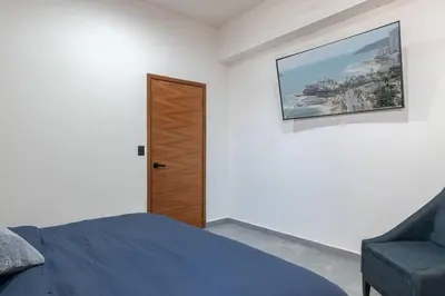 Cama o camas de una habitación en Piso 18 en Malecon con Vista al Mar