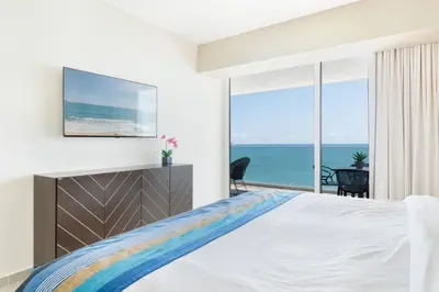 Cama o camas de una habitación en Hermoso Depa lujoso Cristal Bay Sobre el Malecon