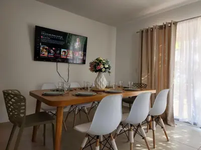 Una televisión o centro de entretenimiento en Casa esmeralda grand