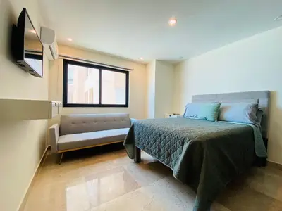 Cama o camas de una habitación en Torre Central 102: Malecón, Lujo y Vistas de ensueño.