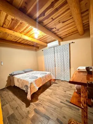 Cama o camas de una habitación en Cabañas Villa Escondida