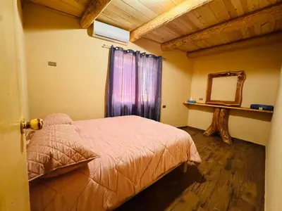 Cama o camas de una habitación en Cabañas Villa Escondida