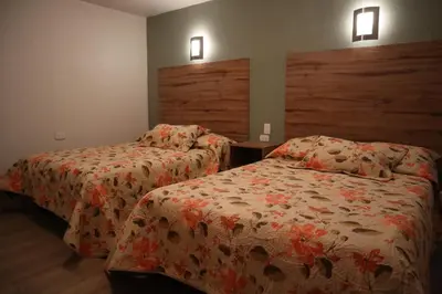 Cama o camas de una habitación en La Casona de los Abuelos