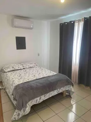Cama o camas de una habitación en Departamento cómodo e impecable