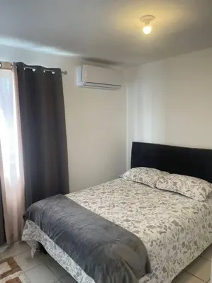 Cama o camas de una habitación en Departamento cómodo e impecable