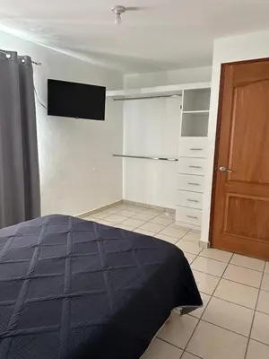 Cama o camas de una habitación en Departamento cómodo e impecable