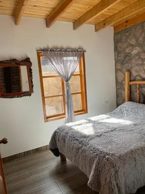 Cama o camas de una habitación en Cabañas El Potrero