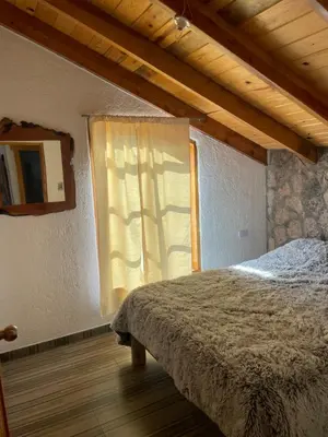 Cama o camas de una habitación en Cabañas El Potrero
