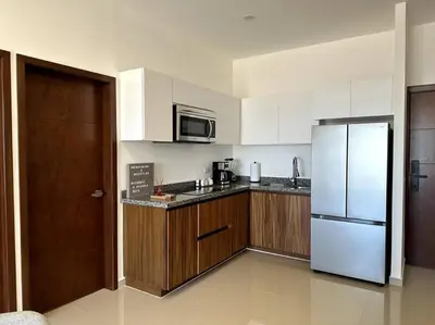 Una cocina o zona de cocina en Cómodo departamento en Mazatlán