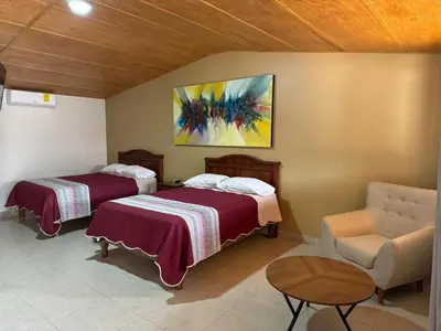 Cama o camas de una habitación en Hotel Posada Doña Celes