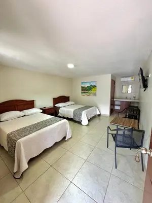 Cama o camas de una habitación en Hotel Posada Doña Celes