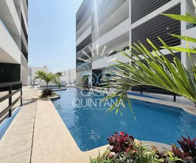 Piscina en o cerca de Cómodo departamento vacacional con amenidades