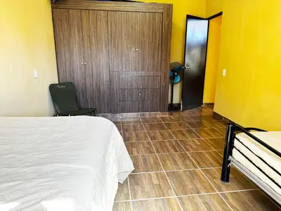 Cama o camas de una habitación en Amplia casa en Parras con wifi, fogatero y asador