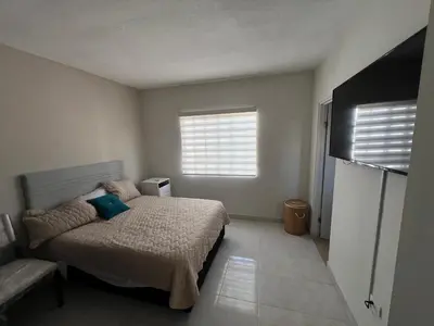 Cama o camas de una habitación en Alojamiento residencial, cerca de TSM