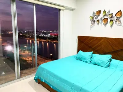 Cama o camas de una habitación en Condominio Portico