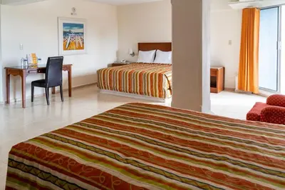 Cama o camas de una habitación en Hotel Plaza del Sol