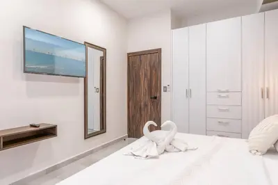 Cama o camas de una habitación en Vista Hermosa en Depa Lujoso Punta Bahia