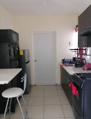 Una cocina o zona de cocina en Excelente casa cómoda