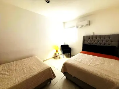 Cama o camas de una habitación en Alejandría Depto Moderno - Café Luxury - 3 Min Malecón y Playas